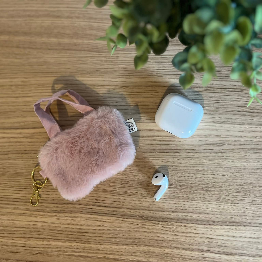 étui pour écouteurs fausse fourrure rose